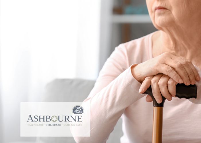 older person with stick looking through the window